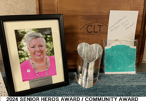 A picture of a person and some awards.